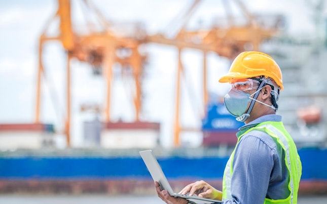 Foreman Controlling the Loading of Containers